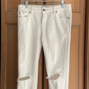 Free People white jeans with ripped knees
